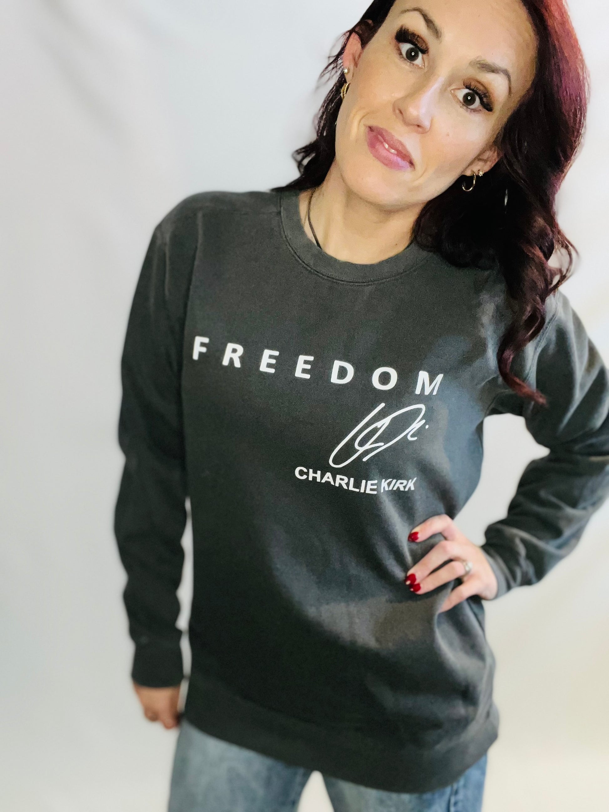 woman in pepper sweater in front of white background