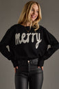 Woman wearing a black sweater with 'merry' text on a gray background