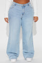 Light blue wide-leg jeans worn by a person on a white background
