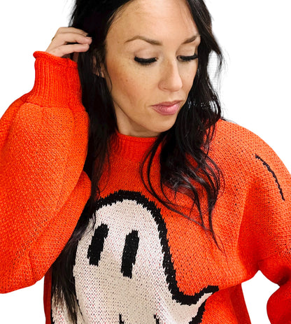 Person wearing a red sweater with a cartoon character design on a white background